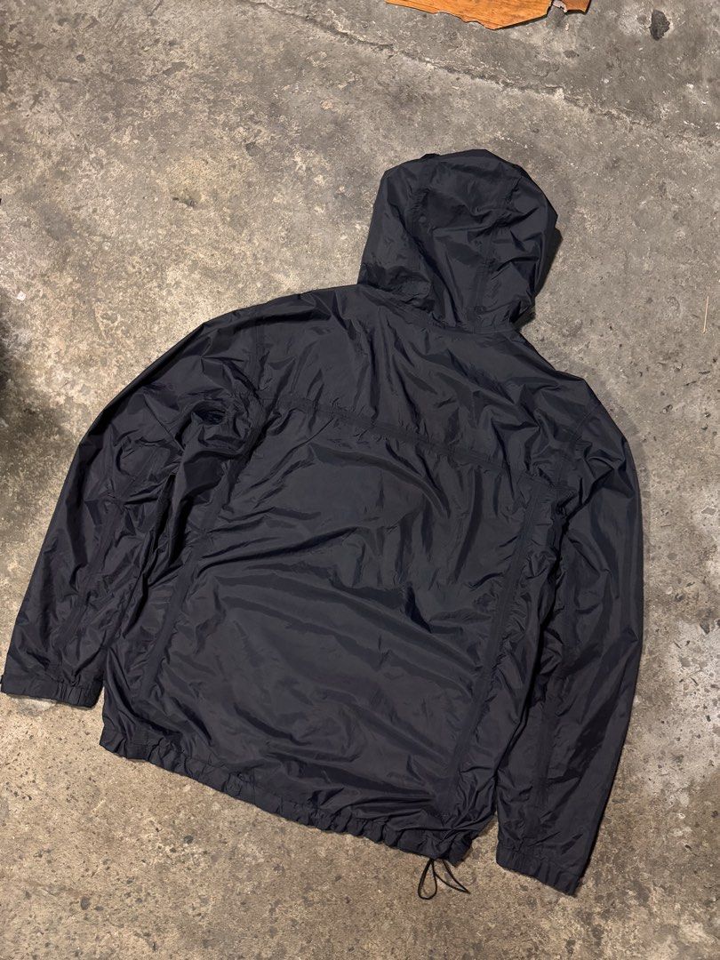 Columbia Black Hooded Windbreaker Jacket (Category: Coats, Jackets and Outerwear) located in Pasig City. Submitted by dripthrift1600 (Listing ID 1465950037, Image 2). Description: - Brand: Columbia - Color: Classic Black - Size: Check measurements (DM for exact fit) - Material: Lightweight, packable nylon with breathable mesh lining - Features: Attached hood, full zip closure with Velcro storm flap, adjustable drawstrings at hood and bottom hem -