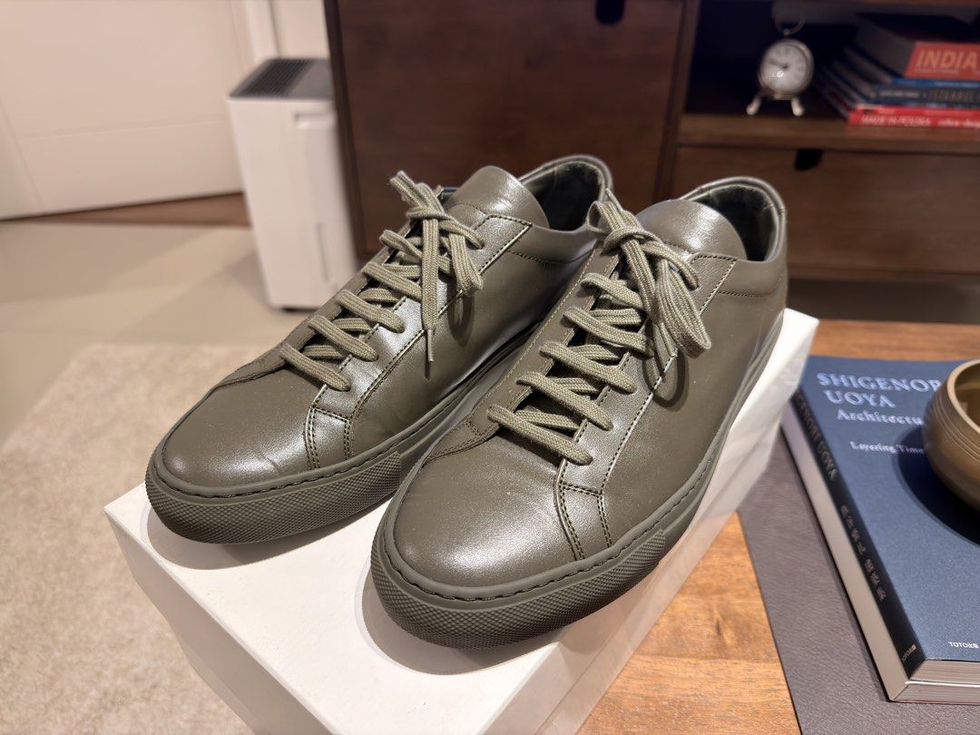 Common Projects Achilles Low Olive Green Leather Sneakers Size 41 (Category: Sneakers) located in Muntinlupa City. Submitted by neatnestu (Listing ID 1465885332, Image 1). Description: - Brand: Common Projects - Model: Achilles Low - Color: Olive green (monochromatic with matching laces/soles) - Size: EU 41 - Condition: Worn a few times, clean leather uppers, slight dust on soles - Inclusions: Original white box, shoe cover and packing paper. I c