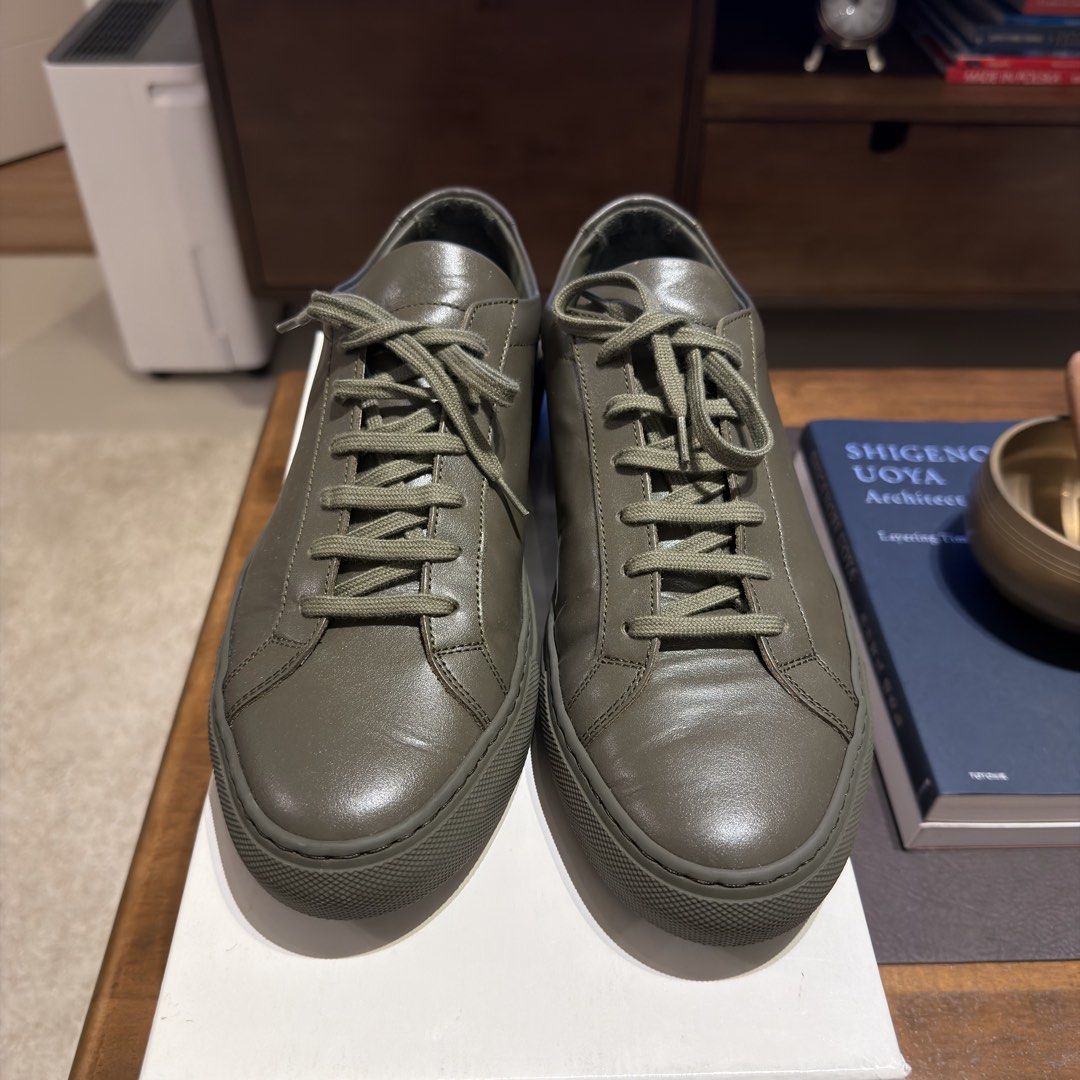 Common Projects Achilles Low Olive Green Leather Sneakers Size 41 (Category: Sneakers) located in Muntinlupa City. Submitted by neatnestu (Listing ID 1465885332, Image 2). Description: - Brand: Common Projects - Model: Achilles Low - Color: Olive green (monochromatic with matching laces/soles) - Size: EU 41 - Condition: Worn a few times, clean leather uppers, slight dust on soles - Inclusions: Original white box, shoe cover and packing paper. I c