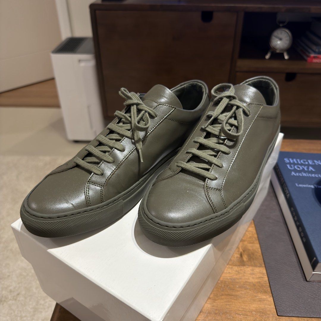 Common Projects Achilles Low Olive Green Leather Sneakers Size 41 (Category: Sneakers) located in Muntinlupa City. Submitted by neatnestu (Listing ID 1465885332, Image 3). Description: - Brand: Common Projects - Model: Achilles Low - Color: Olive green (monochromatic with matching laces/soles) - Size: EU 41 - Condition: Worn a few times, clean leather uppers, slight dust on soles - Inclusions: Original white box, shoe cover and packing paper. I c