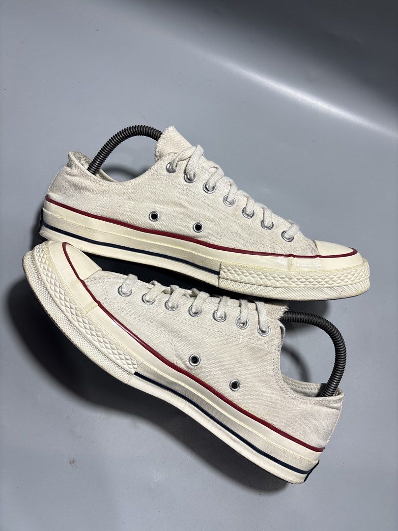 Converse Chuck 70 Low White Parchment Size 9-9.5 (Category: Sneakers) located in Butuan. Submitted by shoeetasho (Listing ID 1465927902, Image 2). Description: - Brand: Converse Chuck 70 Low Top - Color: Parchment White - Size: US 9-9.5 / EUR 42.5 / 27.5cm - Condition: Minimal wear on soles and uppers, clean laces included - Features: Classic rubber toe cap, vulcanized rubber sole with black/red foxing stripes, and black heel license plates.