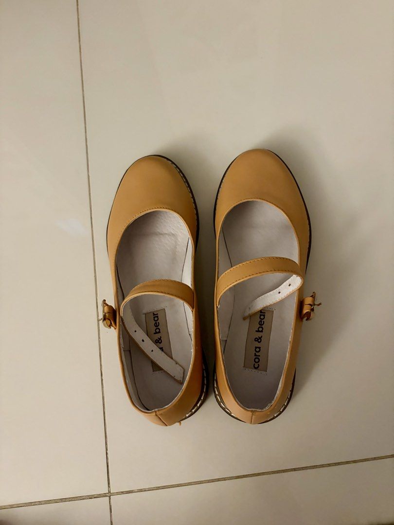 Cora & Bear Yellow Mary Jane Flats Size 7.5 (Category: Flats & Sandals) located in Pasig City. Submitted by sums.chivs (Listing ID 1465911622, Image 2). Description: Cora & Bear Mary Jane flats in tan. Classic rounded toe with an ankle strap and metal buckle. White inner lining with brand tags inside both shoes. Size 7.5 stamped on the bottom soles. Great everyday flats that go with plenty of outfits. Brand new. Only tried it on indoor. RFS: Size