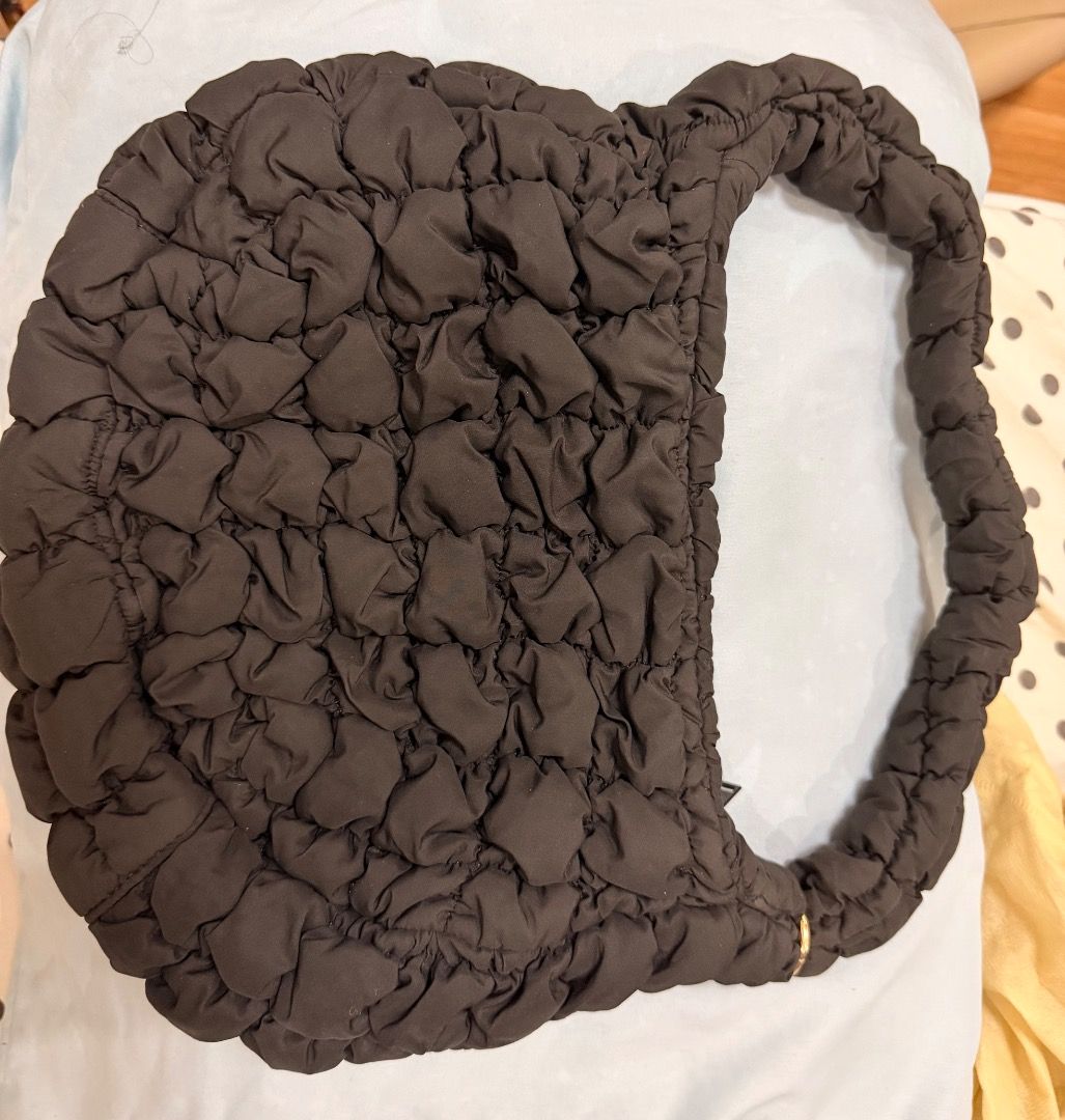 COS Quilted Cloud Bag Black Shoulder Bag (Category: Shoulder Bags) located in Caloocan City. Submitted by phiapitargue (Listing ID 1465850682, Image 3). Description: - Brand: COS - Color: Classic Black - Style: Quilted Cloud Bag / Puffy Everyday Purse - Closure: Secure top zipper - Features: Trendy ruched shoulder strap, soft padded texture - Interior: Lined with original brand tag and care label - Condition: Clean and well-maintained.