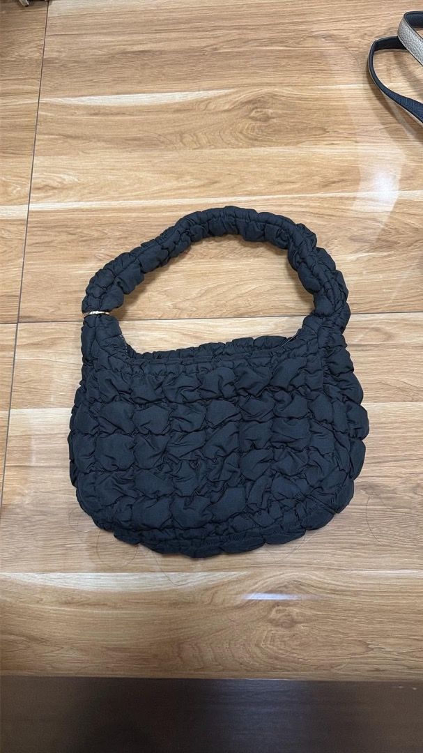COS Quilted Cloud Bag Black Shoulder Bag (Category: Shoulder Bags) located in Caloocan City. Submitted by phiapitargue (Listing ID 1465850682, Image 1). Description: - Brand: COS - Color: Classic Black - Style: Quilted Cloud Bag / Puffy Everyday Purse - Closure: Secure top zipper - Features: Trendy ruched shoulder strap, soft padded texture - Interior: Lined with original brand tag and care label - Condition: Clean and well-maintained.