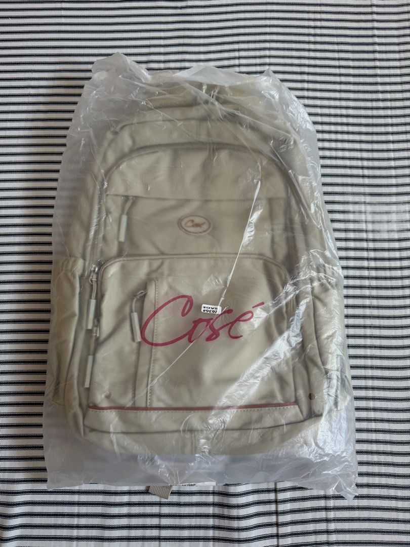 Cose Beige Casual Backpack with Multiple Compartments (Category: Backpacks) located in Cavite. Submitted by chinitolover (Listing ID 1465769921, Image 1). Description: - NEVER BEEN USED - Material: Sturdy canvas - Compartments: Main zip compartment and front zipped pocket - Pouch: Two side water bottle pouches - Comfort: Padded shoulder straps with adjustable buckles - Best for: Everyday campus use or travel.