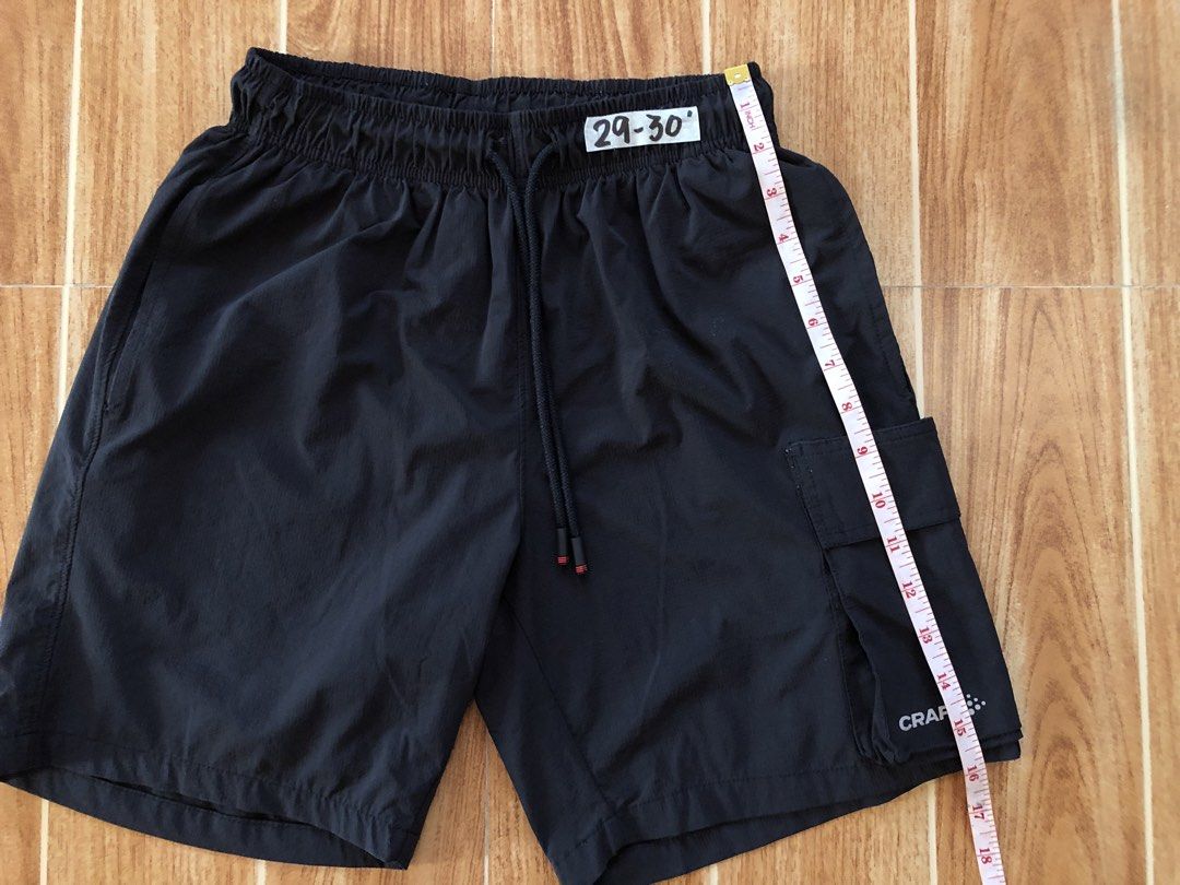 Craft Black Athletic Cargo Shorts (Category: Shorts) located in Tarlac. Submitted by f8njcgvfqy90581 (Listing ID 1465897563, Image 2). Description: - Brand/Style: Craft black athletic shorts - Fit: Size Small, best fits 29-30 waist - Waistband: Elastic with adjustable drawstring - Pockets: Built-in side cargo pocket with Craft logo detail - Fabric: Lightweight and breathable - Versatility: Ideal for gym workouts, running, or casual everyday wear.