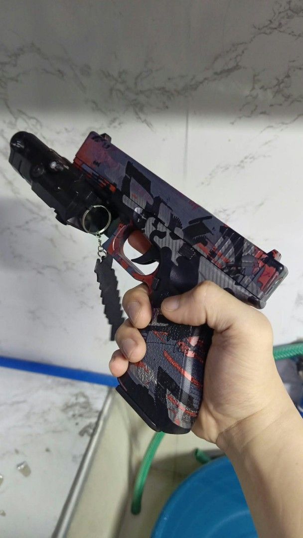 Custom Painted Toy Handgun with Attachment and Keychain (Category: Action & Battle Toys) located in Caloocan City. Submitted by vd2022 (Listing ID 1465933907, Image 1). Description: ksma ung lazer na may flashlight. ung keychain ndi haha,.