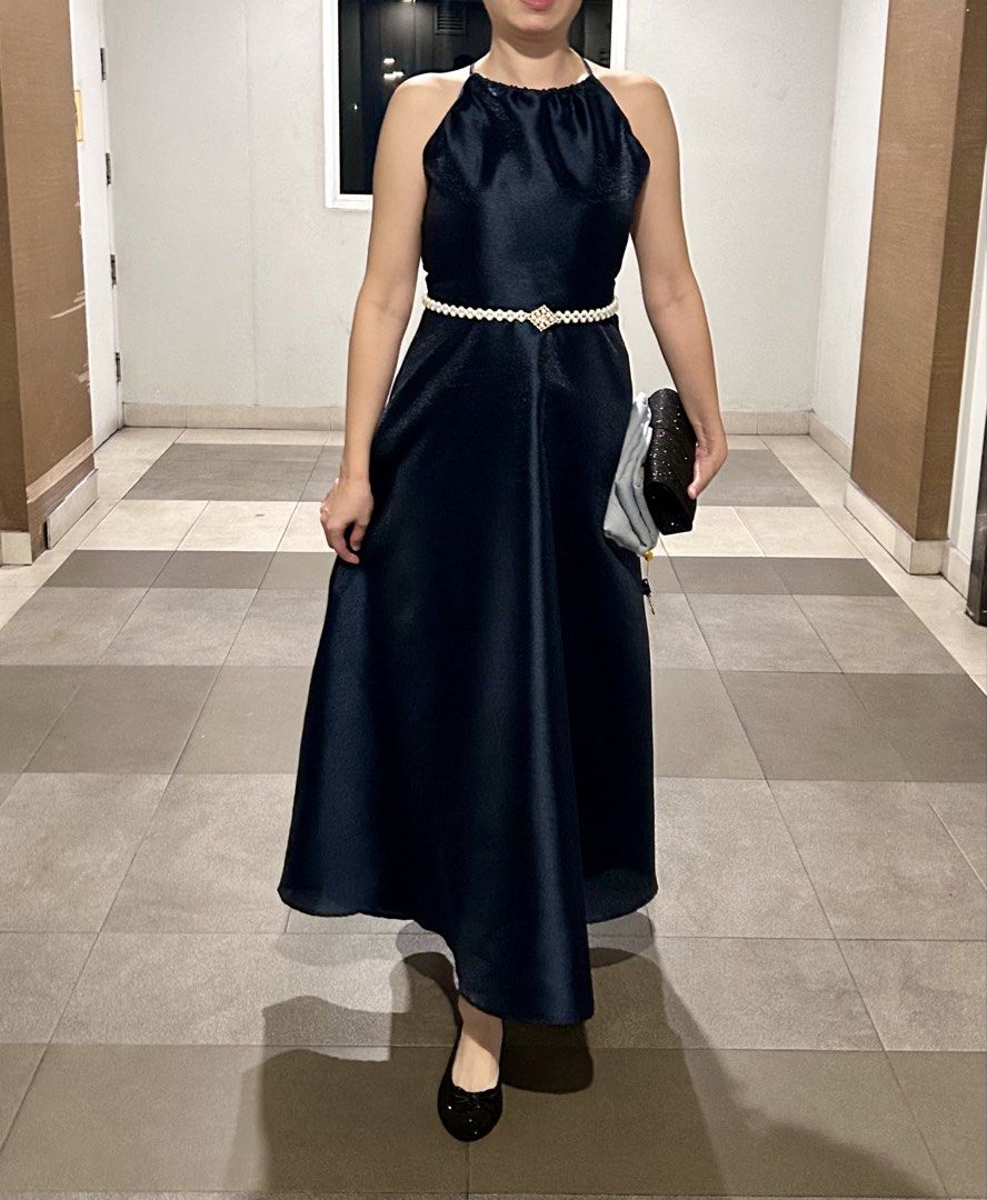 Dark blue halter neck midi dress (Category: Evening dresses & gowns) located in Manila. Submitted by raynebow (Listing ID 1465843720, Image 1). Description: - Color: Dark blue - Style: Halter neckline, fitted waist, and flared mid-calf skirt - Back details: Thin crisscross straps with a back zipper closure - Fabric: Smooth, slightly shiny material that holds its shape nicely - Condition: Worn only once for an event, still in excellent shape - Len