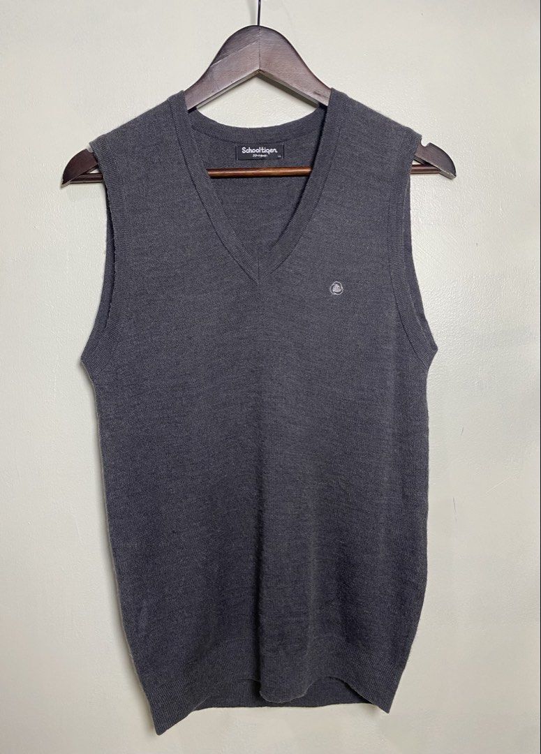 Dark gray v-neck knit vest (Category: Others Tops) located in Makati City. Submitted by indaysukaycloset (Listing ID 1465868064, Image 1). Description: DARK GRAY V-NECK KNIT VEST Brand: Schooltiger (Japan Brand) Size: LL on tag - Fits M-L Color: Dark Gray / Charcoal Details: - W-16.5 L-25 (laid flat, in inches) - V-neck sleeveless knit vest - Small embroidered logo on left chest - Ribbed hem & armhole - classic school / old money style - Material