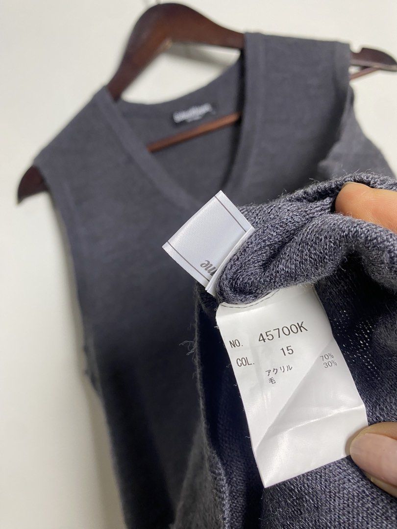 Dark gray v-neck knit vest (Category: Others Tops) located in Makati City. Submitted by indaysukaycloset (Listing ID 1465868064, Image 3). Description: DARK GRAY V-NECK KNIT VEST Brand: Schooltiger (Japan Brand) Size: LL on tag - Fits M-L Color: Dark Gray / Charcoal Details: - W-16.5 L-25 (laid flat, in inches) - V-neck sleeveless knit vest - Small embroidered logo on left chest - Ribbed hem & armhole - classic school / old money style - Material