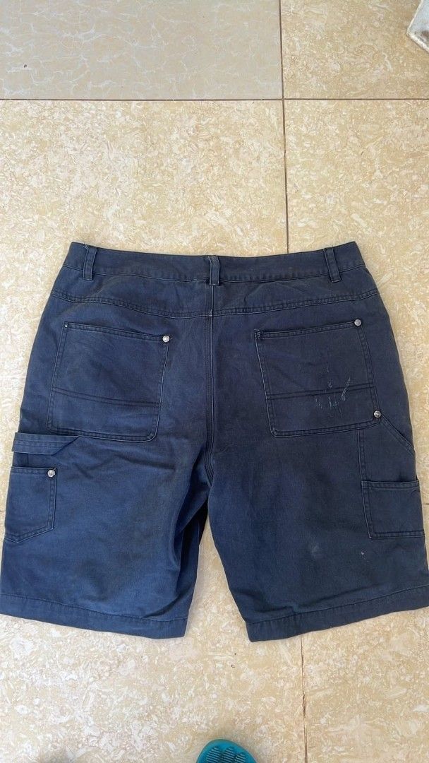 Dark Grey Cargo Utility Shorts with Multiple Pockets (Category: Shorts) located in Bacoor. Submitted by davealvare39194 (Listing ID 1465858863, Image 2). Description: - Color: Dark Grey - Material: Sturdy, durable cotton with metal rivets at stress points - Pockets: Multiple cargo pockets on both legs, plus standard front and back pockets - Fit: Regular fit, sits comfortably at the waist with belt loops - Length: Straight leg cut ending above the