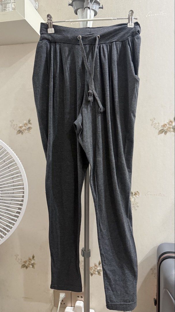Dark Grey Lounge Pants Drawstring Casual Trousers (Category: Other Bottoms) located in Manila. Submitted by zz93305 (Listing ID 1465854344, Image 1). Description: - Color: Dark Grey - Material: Soft, comfortable cotton - Features: Elastic waistband with matching drawstring, two functional side pockets - Fit: Tapered leg style, standard sizing - Condition: Lightly worn, well-maintained, no stains or defects - Best for: Relaxing at home or casual e