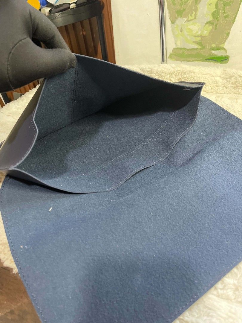 Dark Navy Blue Leather Envelope Laptop Sleeve Bag (Category: Laptop Bags & Sleeves) located in Naawan. Submitted by twilly.apparel2 (Listing ID 1465822172, Image 3). Description: - Color: Dark navy blue - Material: Premium leather with clean front stitching lines - Design: Minimalist envelope style with a secure large foldover flap - Protection: Soft interior compartment keeps your device safe from scratches - Portability: Slim and lightweight pr