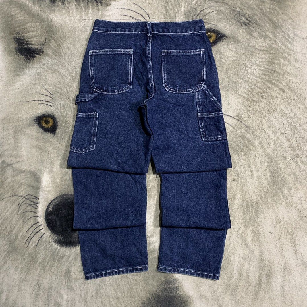 Dark wash denim Carpenter work pants contrast stitching size 29 (Category: Jeans) located in Bulacan. Submitted by puronghustlin (Listing ID 1465915996, Image 1). Description: - Color: Dark blue denim with contrast white stitching - Fit: Straight leg cut with standard belt loops and front button closure - Details: Multiple side and back utility pockets plus a hammer loop - Material: Solid, heavyweight cotton denim - Style: Ideal for daily streetw