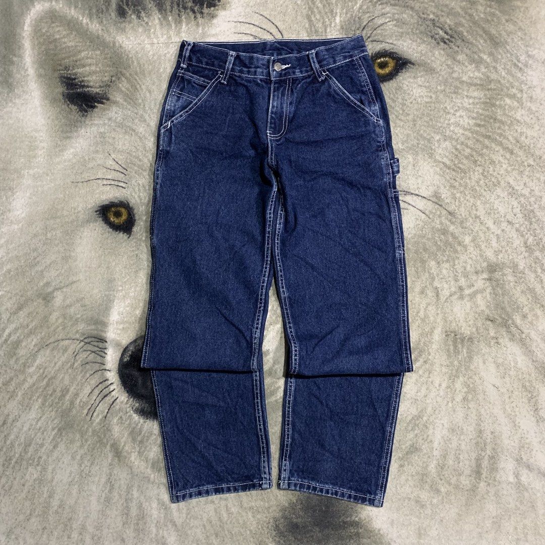 Dark wash denim Carpenter work pants contrast stitching size 29 (Category: Jeans) located in Bulacan. Submitted by puronghustlin (Listing ID 1465915996, Image 3). Description: - Color: Dark blue denim with contrast white stitching - Fit: Straight leg cut with standard belt loops and front button closure - Details: Multiple side and back utility pockets plus a hammer loop - Material: Solid, heavyweight cotton denim - Style: Ideal for daily streetw