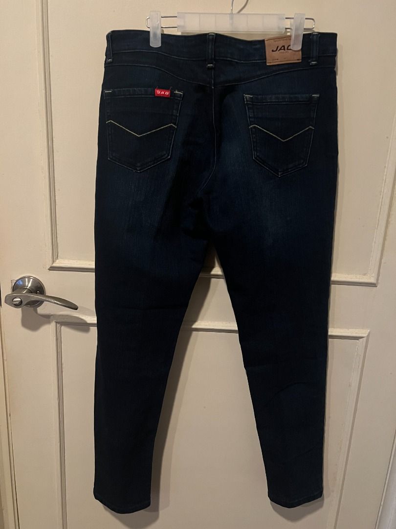 Dark wash denim skinny jeans [p14] (Category: Jeans) located in Pasig City. Submitted by awesamfinds (Listing ID 1465838239, Image 2). Description: - Color: Dark blue - Fit: Slim cut with mid-rise waist - Closure: Standard button and zip fly - Pockets: Classic five-pocket design - Details: Standard belt loops, clean fabric with no noticeable fading or wear - Condition: Good everyday staple, ready to wear Size 34; W: 42 cm flat; L: 94 cm.