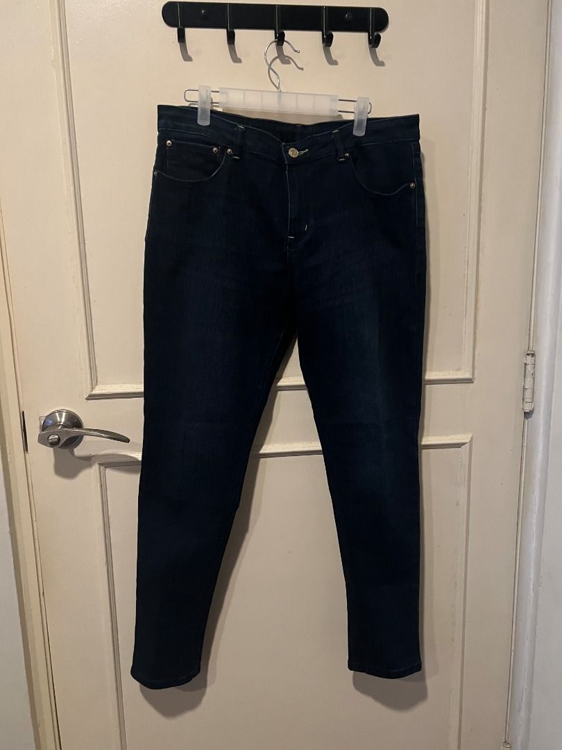 Dark wash denim skinny jeans [p14] (Category: Jeans) located in Pasig City. Submitted by awesamfinds (Listing ID 1465838239, Image 1). Description: - Color: Dark blue - Fit: Slim cut with mid-rise waist - Closure: Standard button and zip fly - Pockets: Classic five-pocket design - Details: Standard belt loops, clean fabric with no noticeable fading or wear - Condition: Good everyday staple, ready to wear Size 34; W: 42 cm flat; L: 94 cm.