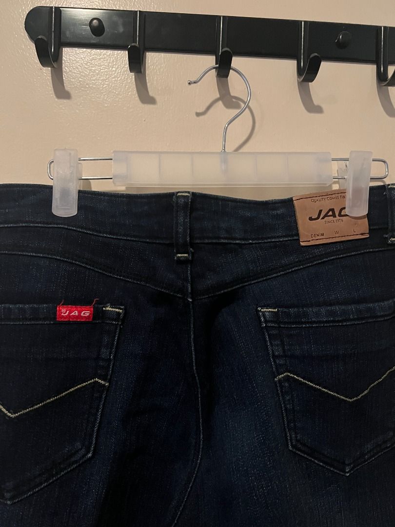Dark wash denim skinny jeans [p14] (Category: Jeans) located in Pasig City. Submitted by awesamfinds (Listing ID 1465838239, Image 3). Description: - Color: Dark blue - Fit: Slim cut with mid-rise waist - Closure: Standard button and zip fly - Pockets: Classic five-pocket design - Details: Standard belt loops, clean fabric with no noticeable fading or wear - Condition: Good everyday staple, ready to wear Size 34; W: 42 cm flat; L: 94 cm.