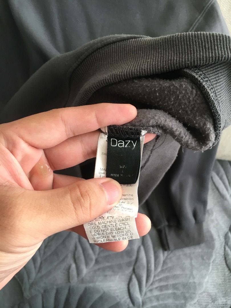 Dazy Slate Hoodie Size L (Category: Hoodies) located in Manila. Submitted by grnickkk (Listing ID 1465775257, Image 2). Description: - Brand: Dazy - Size: L (Relaxed fit) - Color: Grey - Material: Fleece-lined interior (super warm and soft, good weight) - Features: Front kangaroo pocket, double snap buttons on neckline, ribbed cuffs and hem - Condition: Great for chilly days - Fulfillment: Meetup or shipping options available.