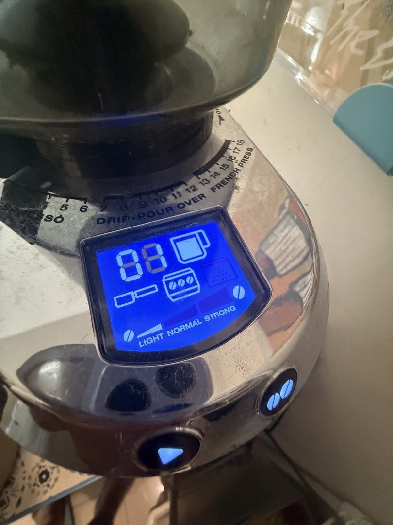 DeLonghi Dedica Coffee Grinder (Category: Coffee Machines & Makers) located in Mandaluyong City. Submitted by ohayouclub (Listing ID 1465840843, Image 3). Description: - Model: DeLonghi Dedica Digital Coffee Grinder - Finish: Sleek stainless steel with clear bean hopper - Display: Blue digital screen for grind settings, cup amounts, and strength options - Versatility: Adjustable dial ranging from fine espresso to coarse French press - Condition: 