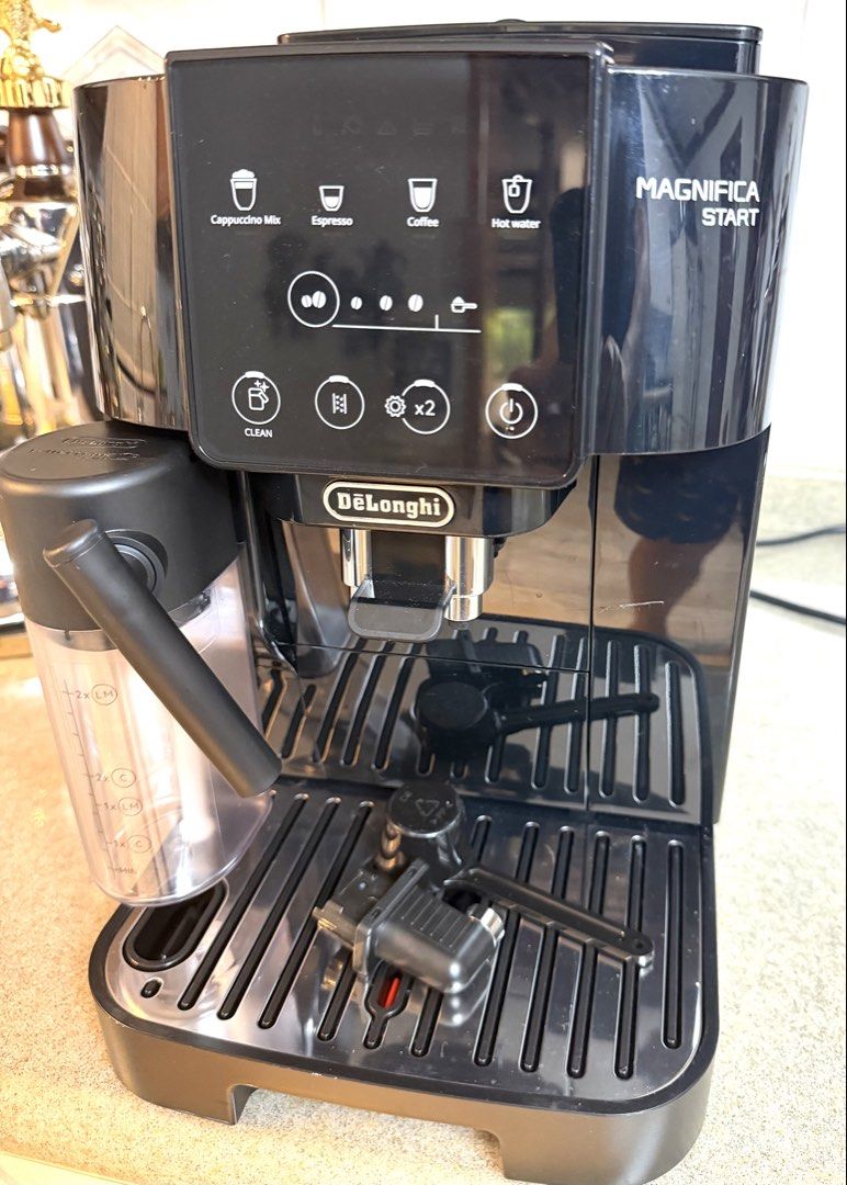 Delonghi Magnifica Start Espresso Cappuccino Coffee Machine (Category: Coffee Machines & Makers) located in Paranaque City. Submitted by jaysanti (Listing ID 1465848745, Image 3). Description: Delonghi Magnifica Start model no. Ecam220.63B super automatic bean to cup coffee machine you can also use ground coffee, can make cappuccino mix, espresso, lungo 0-9-1-5-2-8-7-2-7-5-6 slight damage on the ground coffee cover but it does no affect the coffe