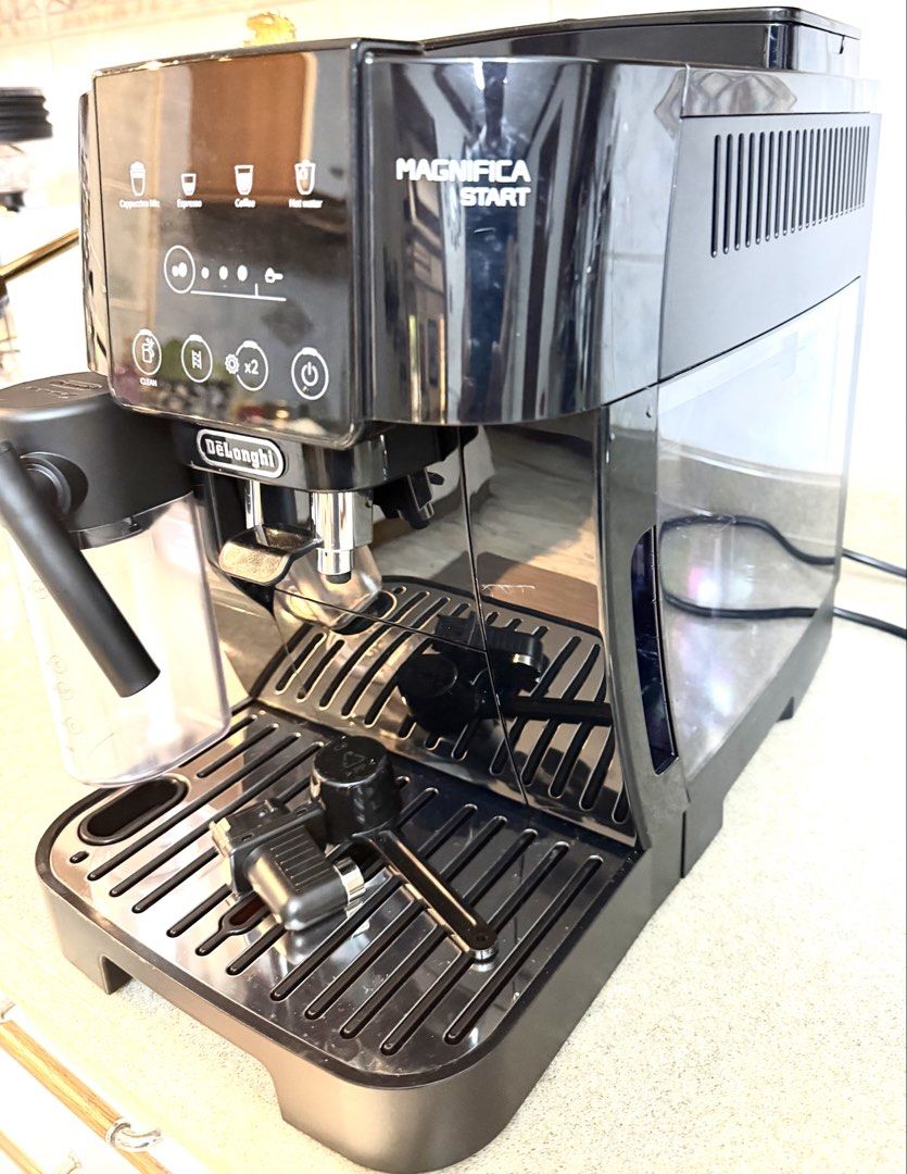 Delonghi Magnifica Start Espresso Cappuccino Coffee Machine (Category: Coffee Machines & Makers) located in Paranaque City. Submitted by jaysanti (Listing ID 1465848745, Image 2). Description: Delonghi Magnifica Start model no. Ecam220.63B super automatic bean to cup coffee machine you can also use ground coffee, can make cappuccino mix, espresso, lungo 0-9-1-5-2-8-7-2-7-5-6 slight damage on the ground coffee cover but it does no affect the coffe