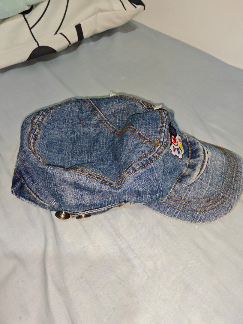 Denim Hat with Union Pride Patch (Category: Hats & Beanies) located in Quezon. Submitted by strawberry_me (Listing ID 1465796418, Image 3). Description: - Style: Streetwear blue denim cap - Details: Contrast yellow stitching and side button accent - Finish: Distressed, frayed edges on the visor and crown - Design: Colorful 'Union Pride' patch with a red maple leaf center - Fit: Unisex, great for everyday casual outfits - Condition: Brand new / Ex