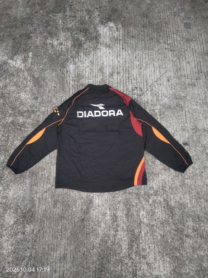 Diadora Windbreaker (Category: Coats, Jackets and Outerwear) located in Caloocan City. Submitted by haruconcep52476 (Listing ID 1465140020, Image 2). Description: Dimensions W22×L28 Good condition Color rate 9 Issue faded back print.
