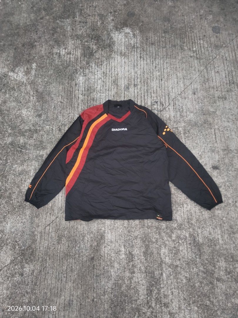 Diadora Windbreaker (Category: Coats, Jackets and Outerwear) located in Caloocan City. Submitted by haruconcep52476 (Listing ID 1465140020, Image 1). Description: Dimensions W22×L28 Good condition Color rate 9 Issue faded back print.