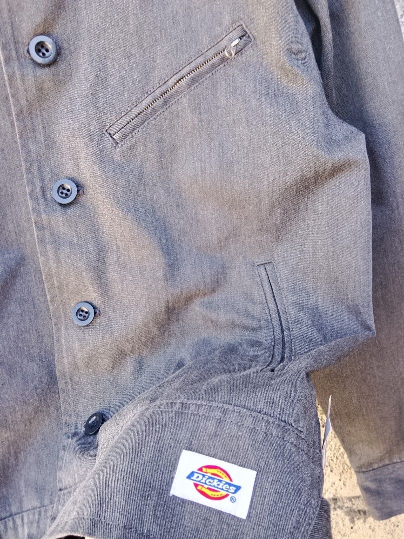 Dickies button-front work jacket (Category: Coats, Jackets and Outerwear) located in Bayombong. Submitted by jeffreybee (Listing ID 1465793967, Image 3). Description: BRAND NEW CONDI 26 Length 21.5 width Dickies button-front work jacket featuring a classic collar, angled chest pocket with a zipper, and side hand pockets..