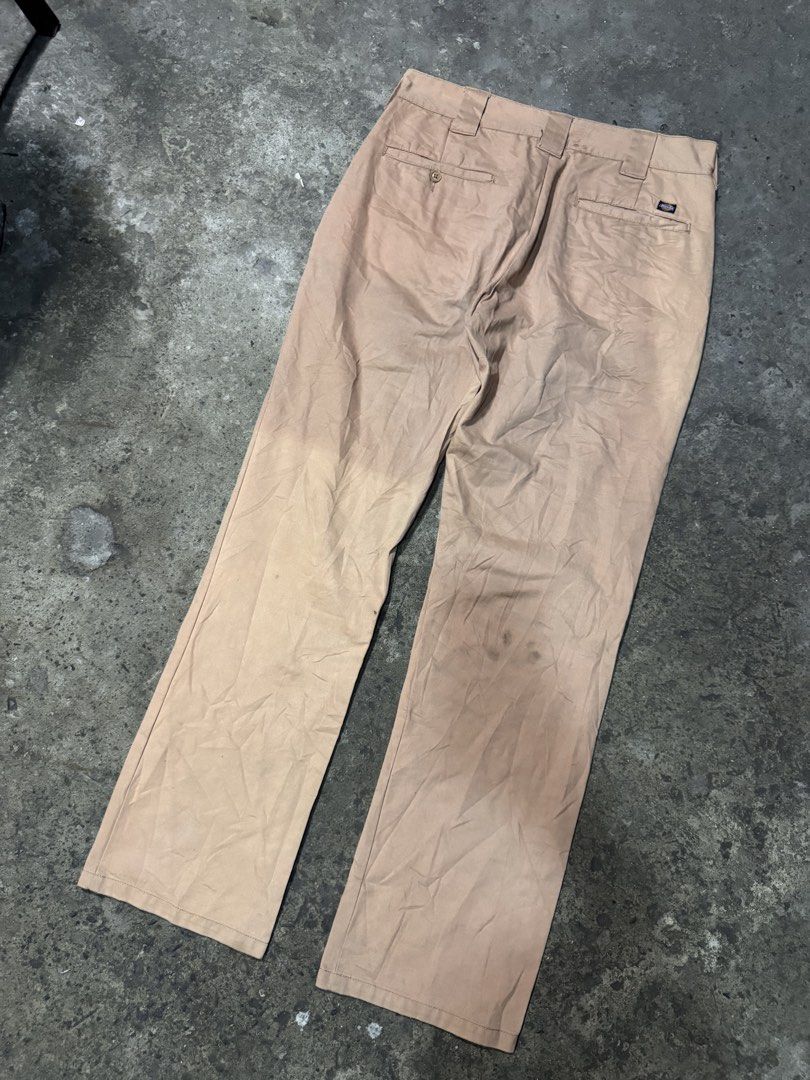 Dickies Khaki Work Pants Chinos (Category: Chinos) located in Pasig City. Submitted by dripthrift1600 (Listing ID 1465949622, Image 2). Description: - Brand: Dickies - Color: Khaki Tan - Fit: Classic straight leg - Details: Sturdy belt loops, rear welt pockets, iconic logo tag on back pocket - Condition: Stains and wear marks throughout for an authentic worn-in look - Style: Ideal everyday skate pants or reliable workwear staple - Dimes: 32x42x8.