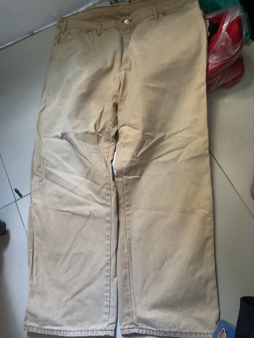 Dickies Men's Khaki Cargo Work Pants (Category: Trousers) located in Batac City. Submitted by egorospe (Listing ID 1465796837, Image 1). Description: - Brand: Dickies - Color: Khaki - Material: Heavy-duty canvas fabric - Fit: Relaxed fit through the legs - Features: Utility pockets on the sides, left leg hammer loop, and multiple back pockets with Dickies logo patch - Condition: Excellent / Pre-loved - Style: Ideal for job sites, manual work, or 