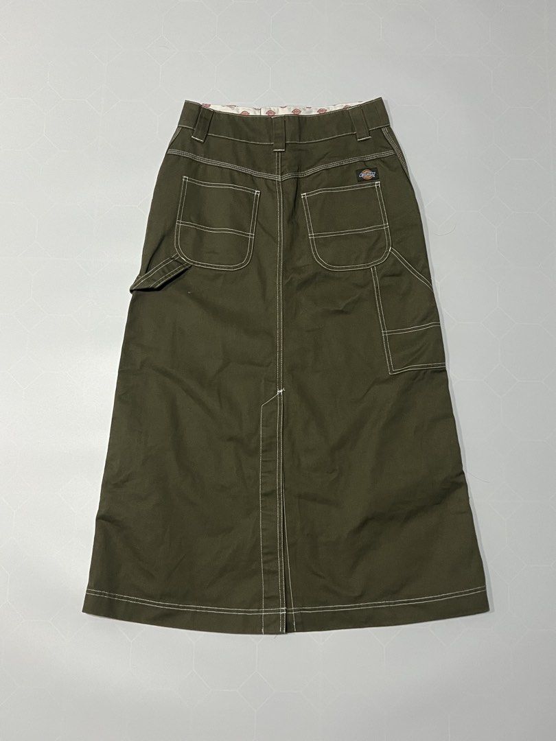 Dickies Olive Green Cargo Midi Skirt (Category: Skirts) located in Caloocan City. Submitted by lostarchive_55 (Listing ID 1465916178, Image 1). Description: - Brand: Dickies - Item: Utility midi skirt in olive green - Material: Heavy-duty cotton twill with contrast white stitching - Fit: High-waisted with belt loops, zip fly, and button closure - Details: Multiple side/back utility pockets, hammer loop, and front hem slit - Branding: Iconic Dicki