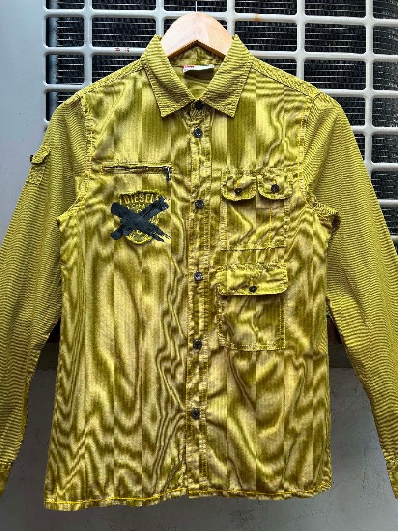 Y2K Diesel Utility Longsleeve Shirt (Category: Longsleeves) located in Manila. Submitted by zerowastethriftco. (Listing ID 1465934085, Image 3). Description: -As New Condition -Size L on Tag -Dimes L25xW17 -No Issue -This is a vintage Diesel long-sleeve utility work shirt/jacket in a distinctive mustard yellow hue with thin vertical stripes. -Authentic pieces from this specific Diesel era are highly sought after now due to the massive resurgence 