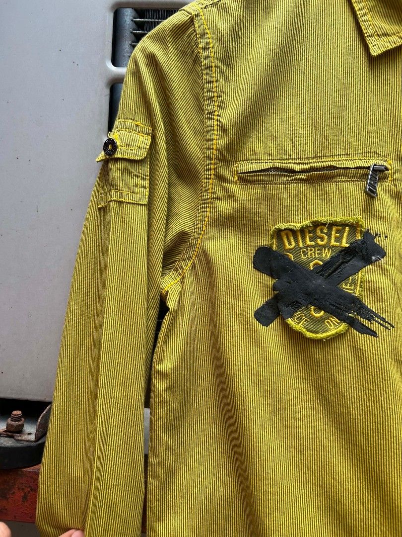 Y2K Diesel Utility Longsleeve Shirt (Category: Longsleeves) located in Manila. Submitted by zerowastethriftco. (Listing ID 1465934085, Image 2). Description: -As New Condition -Size L on Tag -Dimes L25xW17 -No Issue -This is a vintage Diesel long-sleeve utility work shirt/jacket in a distinctive mustard yellow hue with thin vertical stripes. -Authentic pieces from this specific Diesel era are highly sought after now due to the massive resurgence 