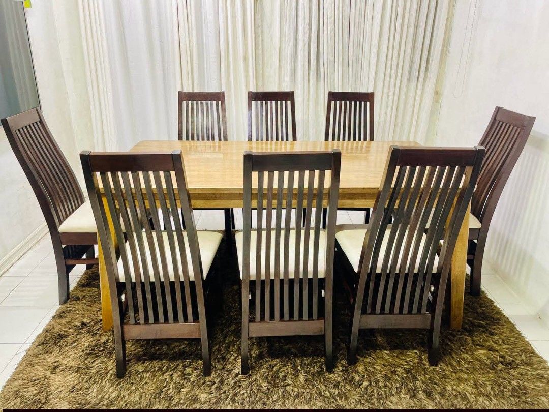 Dining Chair (Category: Tables & Sets) located in Meycauayan. Submitted by marygracecasimiro (Listing ID 1465879393, Image 1). Description: From Vietnam Solid wood pencil leg table with 8 chair Wooden dining table set with dark brown slatted-back chairs featuring light beige upholstered seat cushions Get this for only 30k♥️ Dimension L: 67 x W34 x H30 inches.