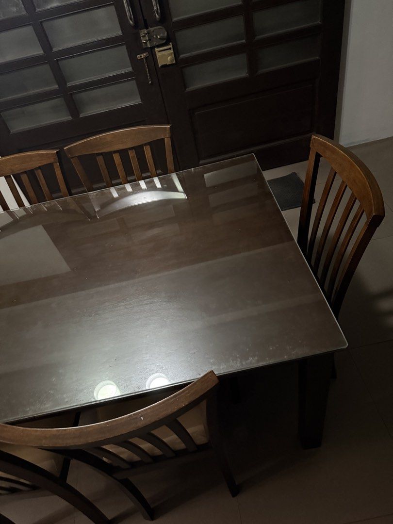 Dining Set 6-Seater (Category: Tables & Sets) located in Marikina City. Submitted by cluttermatters (Listing ID 1465862931, Image 3). Description: There are some visible water stains on the glass surface. 150cm x 90cm x 74cm.