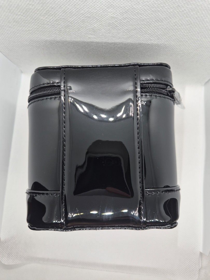 Dior Beauty Black Patent Vanity Case (Category: Luxury Bags & Wallets) located in Manila. Submitted by prelovedbyc.hannah (Listing ID 1465879317, Image 3). Description: - Authentic Dior Beauty cosmetic case - Sleek black patent finish with iconic embossed CD logo - Structured box shape equipped with a convenient top handle - Secure zip-around top opening - Spacious interior lined in black fabric with repeated CD monograms and official tag - Perfe