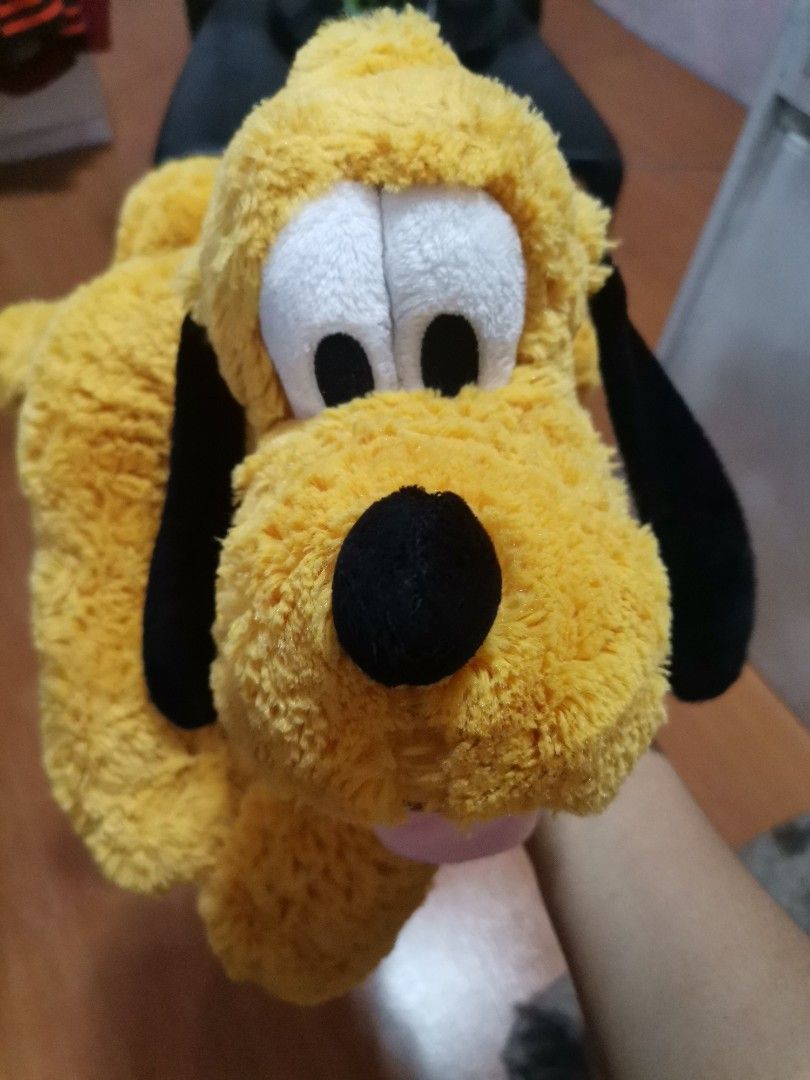 Disney Store Pluto Plush Toy with Green Collar (Category: Plushies & Soft Toys) located in Makati City. Submitted by kookybearsstuff (Listing ID 1465888416, Image 1). Description: - Authentic Disney Store Pluto plush toy - Features iconic yellow body, black floppy ears, and green collar - Playful design with tongue sticking out - Original Pasadena, CA tag still attached - Perfect gift for Disney fans and collectors - Ships securely from a trusted