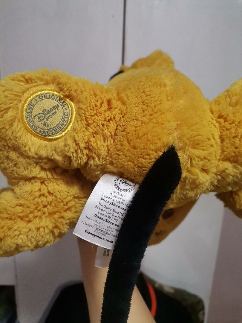Disney Store Pluto Plush Toy with Green Collar (Category: Plushies & Soft Toys) located in Makati City. Submitted by kookybearsstuff (Listing ID 1465888416, Image 3). Description: - Authentic Disney Store Pluto plush toy - Features iconic yellow body, black floppy ears, and green collar - Playful design with tongue sticking out - Original Pasadena, CA tag still attached - Perfect gift for Disney fans and collectors - Ships securely from a trusted