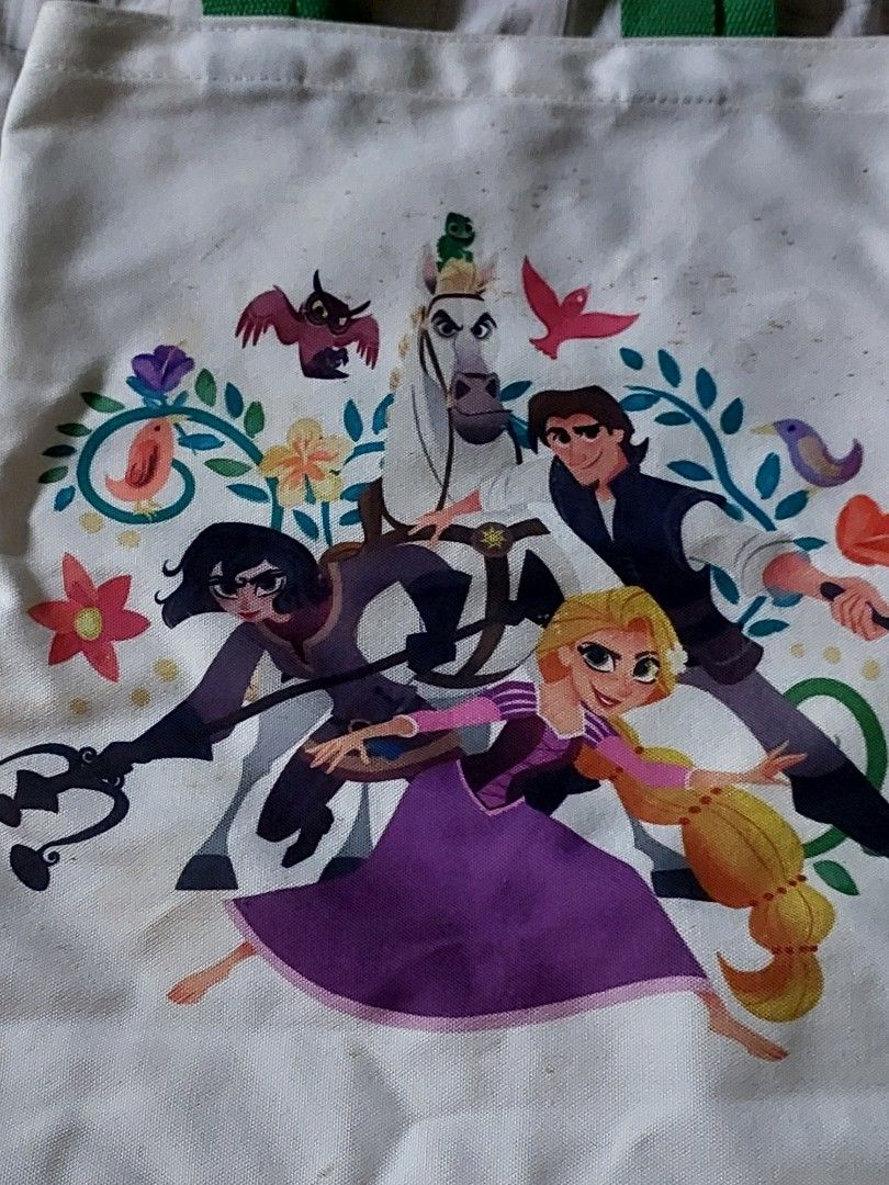 DISNEY TANGLED ALLDAY TOTE BAG (Category: Luxury Bags & Wallets) located in Las Pinas. Submitted by g.bonx (Listing ID 1465790101, Image 1). Description: to declutter items ° limited branches only ° disney tangled tote bag ° has stains / kinda worn out ° lower your expectations from the item ° bag is perfectly can be use if you're a rapunzel disney lover MOP: GCASH MOD: JNT EXPRESS DM if interested 📩‼️.