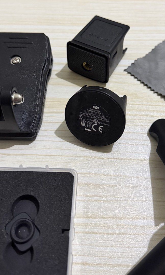 DJI Osmo Pocket 1 with Controller Wheel and Wireless Module (Category: Cameras) located in Taguig. Submitted by aymjeyarbi (Listing ID 1465803976, Image 3). Description: Complete DJI Osmo Pocket 1 vlogging bundle: - DJI controller wheel module and wireless charging base module included - TinyRigs protective case - Standee & charging tripod - Mini tripod - Wide-angle lens - 360 Backpack clip.