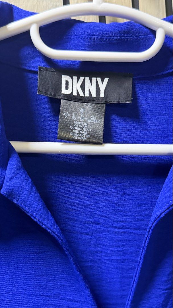 DKNY Midi Dress (Category: Dresses) located in Muntinlupa City. Submitted by avampaya (Listing ID 1465909375, Image 3). Description: DKNY dress in iris blue. Collared V-neckline with short puff sleeves. Fitted waist with a tie belt detail on the side. Flowy midi length skirt. .