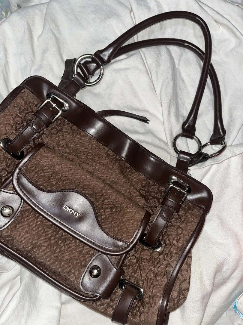 DKNY Vintage Monogram Bag (Category: Luxury Bags & Wallets) located in Taguig. Submitted by mikacxz (Listing ID 1465920028, Image 1). Description: A classic and timeless piece, perfect for everyday use! 🤎 with dust bag ! Condition: - Preloved - Has stains on the interior lining only ! - Metal hardware has minimal to visible rust - Still pretty and functional.