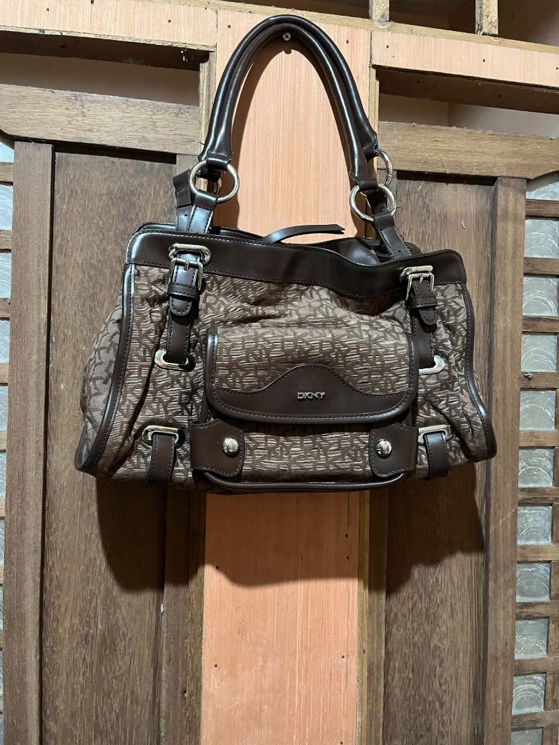 DKNY Vintage Monogram Bag (Category: Luxury Bags & Wallets) located in Taguig. Submitted by mikacxz (Listing ID 1465920028, Image 2). Description: A classic and timeless piece, perfect for everyday use! 🤎 with dust bag ! Condition: - Preloved - Has stains on the interior lining only ! - Metal hardware has minimal to visible rust - Still pretty and functional.