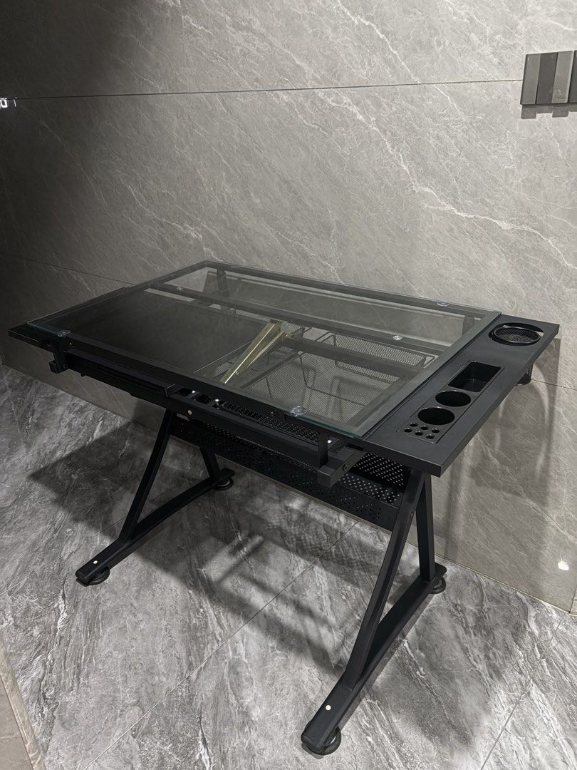 Drafting Table (Category: Tables & Sets) located in Manila. Submitted by seaottercat (Listing ID 1465947715, Image 1). Description: Drafting Table with Glass Top Selling my drafting table, lightly used and has flaws but barely noticeable unless pointed out Price is Negotiable. MOP: Gcash/Maya/Gotyme/Maribank RFS: decluttering.