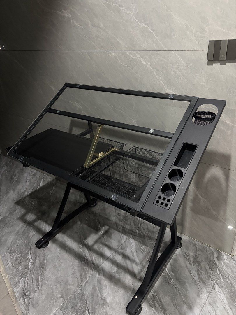 Drafting Table (Category: Tables & Sets) located in Manila. Submitted by seaottercat (Listing ID 1465947715, Image 2). Description: Drafting Table with Glass Top Selling my drafting table, lightly used and has flaws but barely noticeable unless pointed out Price is Negotiable. MOP: Gcash/Maya/Gotyme/Maribank RFS: decluttering.