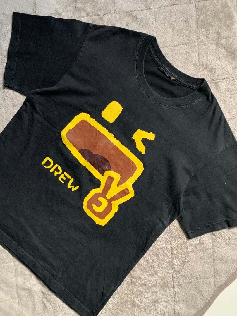 Drew House Black Tee With Graphic Print (Category: Activewear) located in Sorsogon. Submitted by sell_triftv2 (Listing ID 1465828563, Image 2). Description: DREW in the house black-t ‎ ‎📏size(inches) ‎Width:19.6 ‎Length:26.3 ‎sleeve:14.8 ‎ ‎Condition:10/10 ‎Color rate:10/10 ‎issue:cut tag ‎ ‎🏷️price:250php ‎ ‎📍MOP ‎payment first/no COD!! ‎gcash payment ‎J&T/meet up ‎ ‎📌dm me or comment mine for purchasement ‎📌Colors may vary slightly due to 