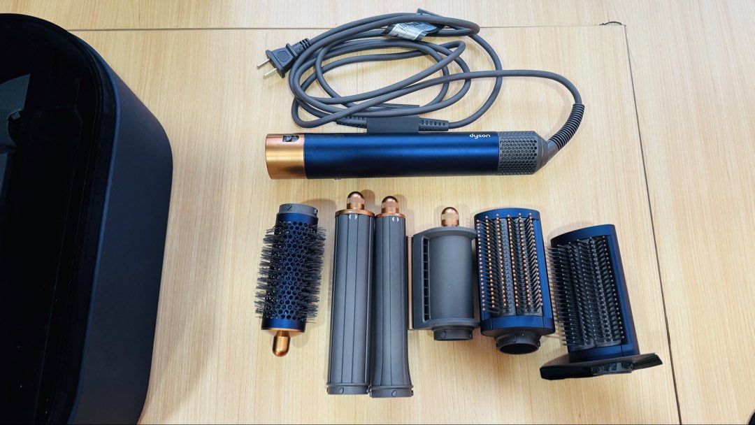 Dyson Airwrap Complete Long – Prussian Blue / Copper (Category: Hair) located in Pasig City. Submitted by decltter01 (Listing ID 1465861700, Image 2). Description: Authentic Dyson Airwrap Complete Long in Prussian Blue / Copper Some attachments are still brand new / unused. Purchased directly from Dyson Podium in 2022 - Philippine-bought unit, not imported. COMPLETE SET: * Dyson Airwrap multi-styler * 30mm long barrel * 40mm long barrel * Firm sm
