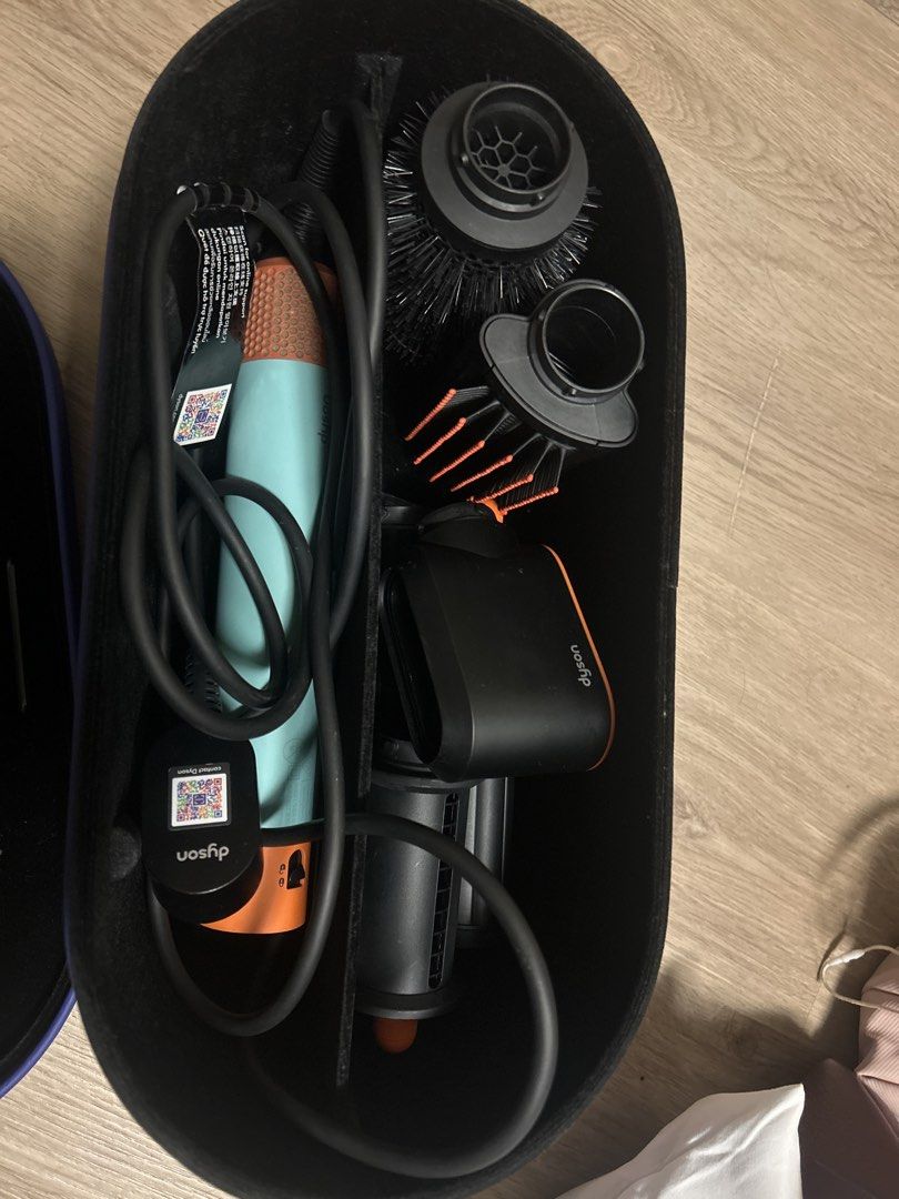 Dyson Airwrap i.d. multi-styler and dryer (Category: Hair) located in Quezon City. Submitted by cheriesonlineshop (Listing ID 1465884628, Image 3). Description: - Authentic Dyson Airwrap i.d. multi-styler in a stunning Mint Green and Orange colorway - Full set complete with all original attachments: styling barrels, round volume brush, smoothing brush, and dryer attachment - Includes the original Dyson presentation storage case - Comes with origi